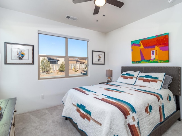 bedroom featuring ceiling fan and light colored carpet