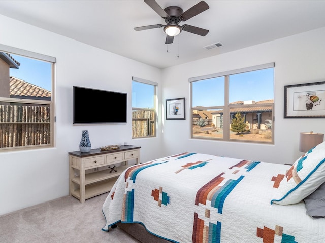 carpeted bedroom with ceiling fan