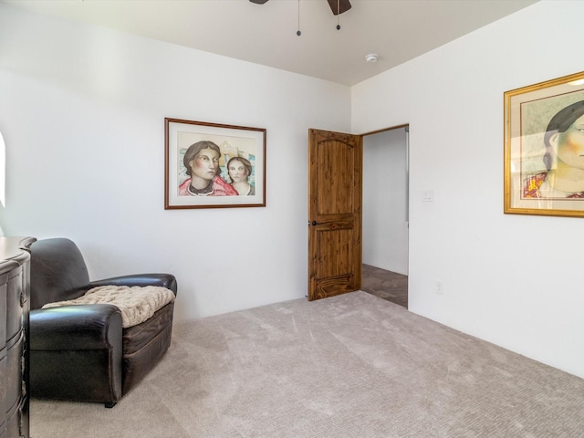 sitting room with light carpet and ceiling fan