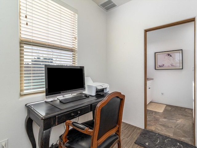 home office with wood-type flooring