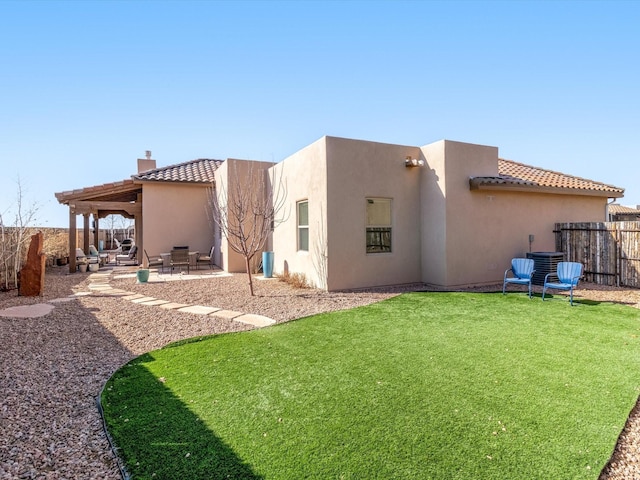 rear view of house with central AC unit, a patio area, and a lawn