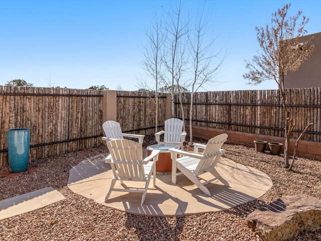 view of patio / terrace featuring an outdoor fire pit