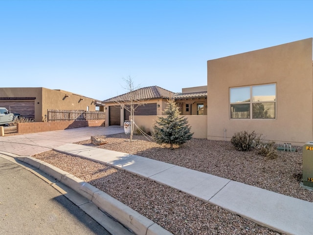 southwest-style home featuring a garage