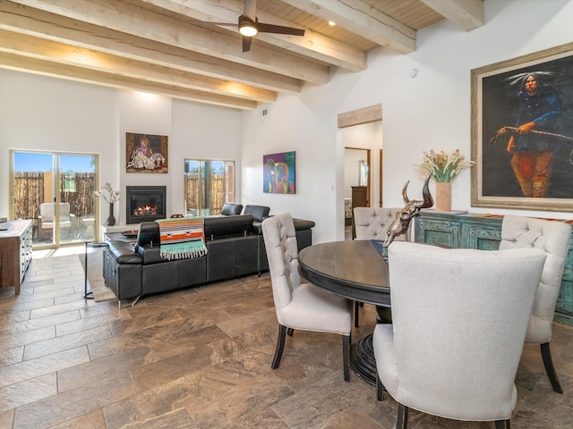 dining area with beamed ceiling and wooden ceiling