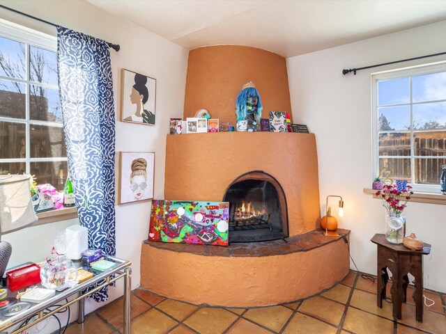 bedroom featuring light tile patterned floors and two closets