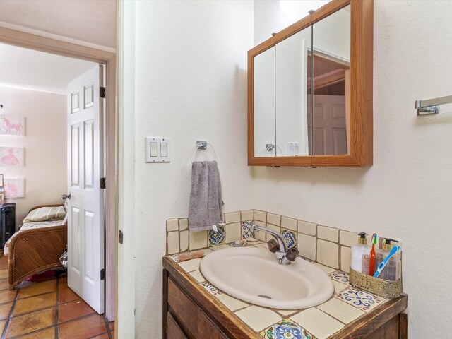 bedroom with radiator heating unit and tile patterned floors