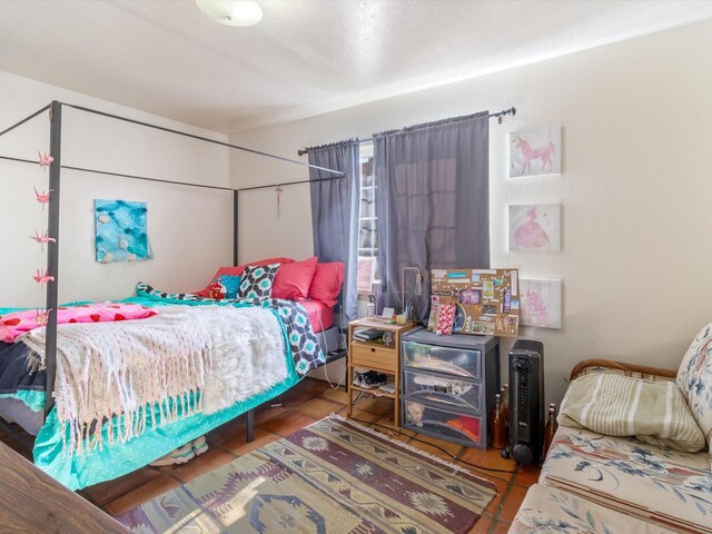 bedroom with tile patterned floors