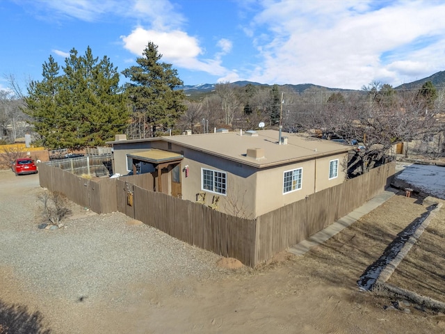 view of side of property with a mountain view