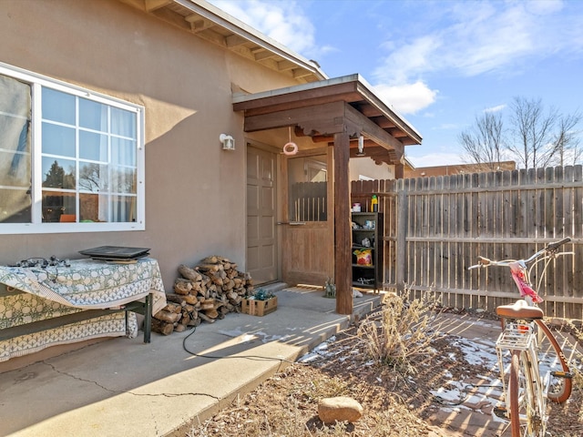 doorway to property featuring a patio area