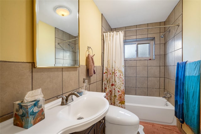 full bathroom with toilet, vanity, shower / bathtub combination with curtain, and tile walls