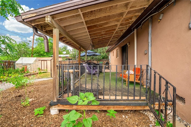 deck featuring an outdoor structure