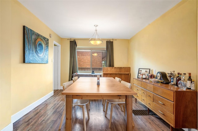 dining room featuring dark hardwood / wood-style flooring