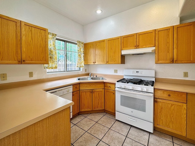 kitchen with light tile patterned flooring, sink, and white appliances