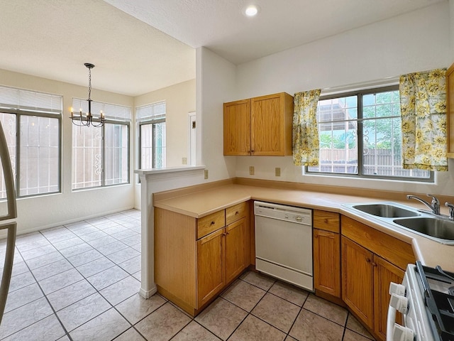 kitchen with light tile patterned flooring, sink, hanging light fixtures, white appliances, and an inviting chandelier