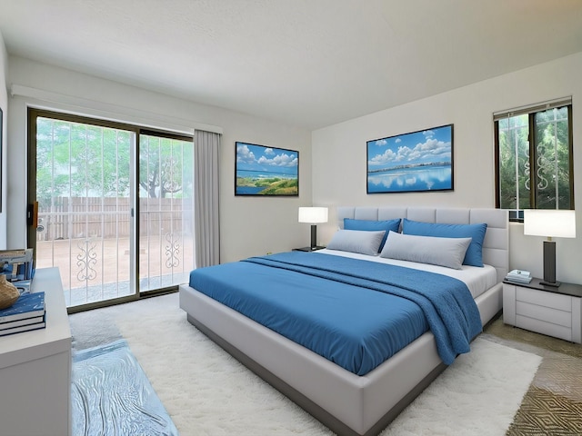 bedroom featuring access to exterior and light colored carpet