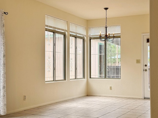 empty room featuring a notable chandelier