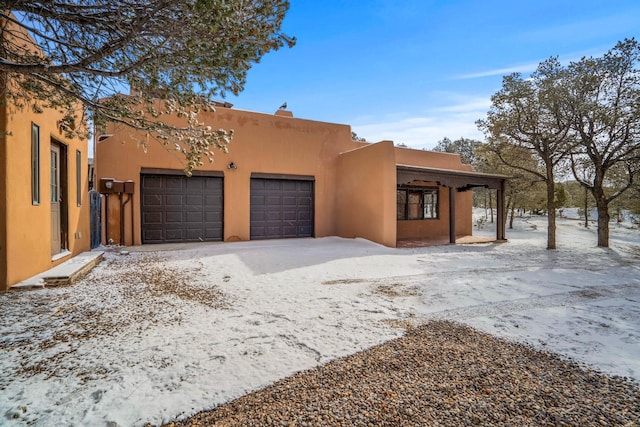 southwest-style home with a garage