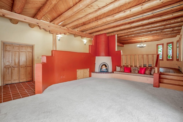 basement with dark colored carpet, an inviting chandelier, and wooden ceiling