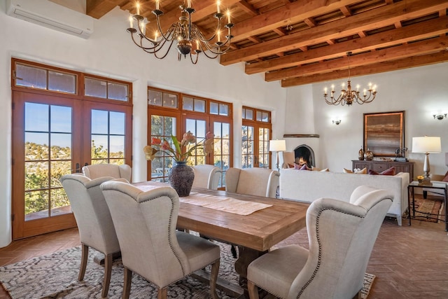 dining room featuring french doors, a wall mounted air conditioner, a notable chandelier, beamed ceiling, and a fireplace