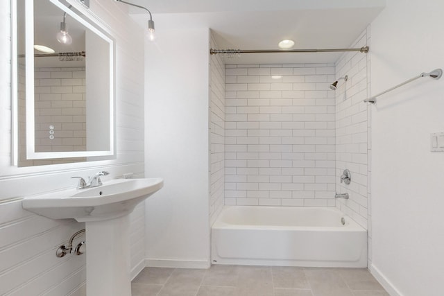 bathroom with tile patterned flooring and tiled shower / bath combo