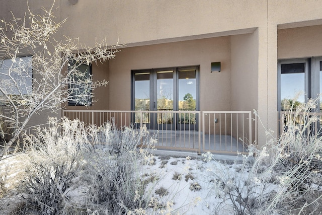 view of snow covered property entrance