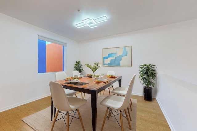 dining area with light hardwood / wood-style floors