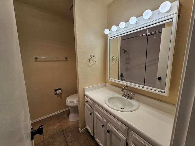 bathroom with tile patterned floors, toilet, and vanity