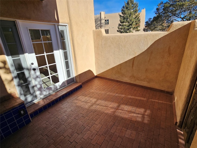 view of patio featuring a balcony