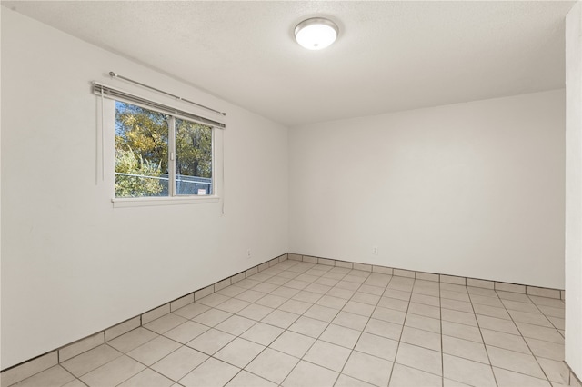 empty room featuring a textured ceiling