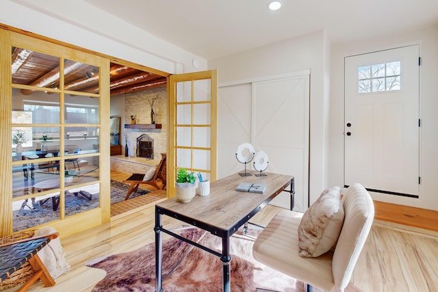 office space featuring hardwood / wood-style flooring and a fireplace