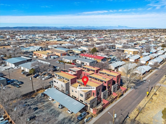 birds eye view of property with a mountain view