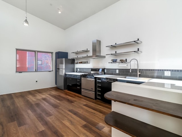 kitchen featuring dark wood-type flooring, open shelves, ventilation hood, stainless steel appliances, and light countertops