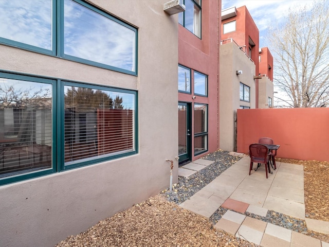 view of patio featuring fence