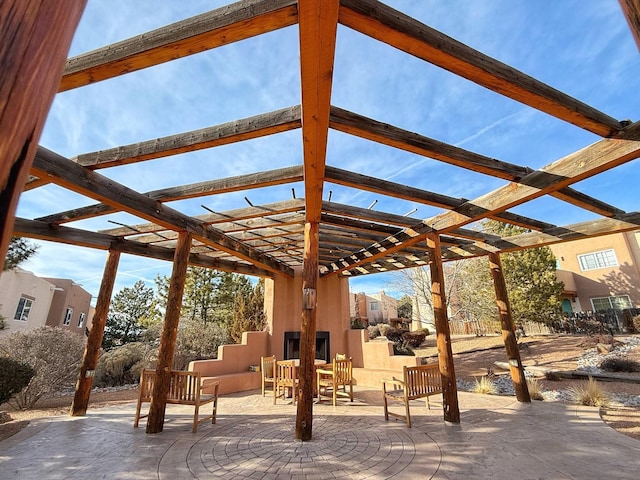 view of community featuring a patio and a pergola