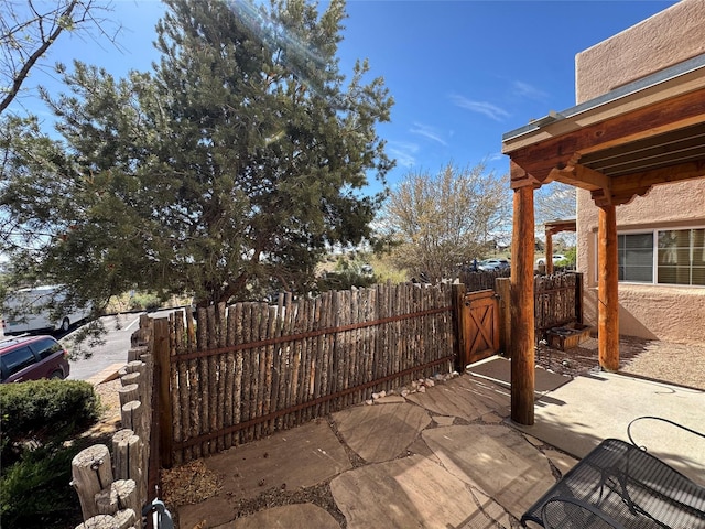 2210 Miguel Chavez Rd Unit 815, Santa Fe, NM 87505 - view of patio / terrace featuring fence and a gate