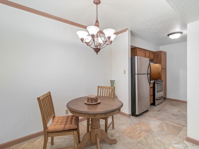 dining space featuring a textured ceiling and a notable chandelier