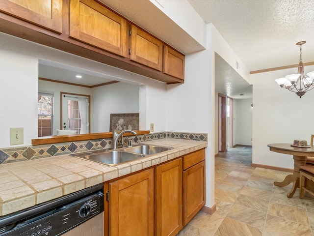 kitchen featuring sink, tile countertops, hanging light fixtures, a textured ceiling, and stainless steel dishwasher