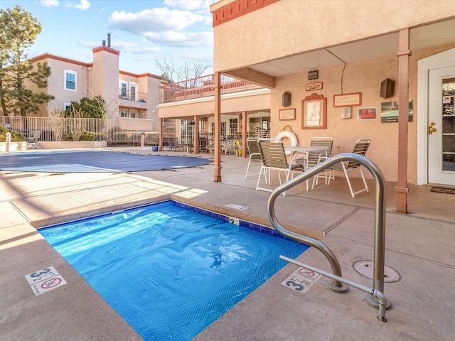 view of pool featuring a patio area