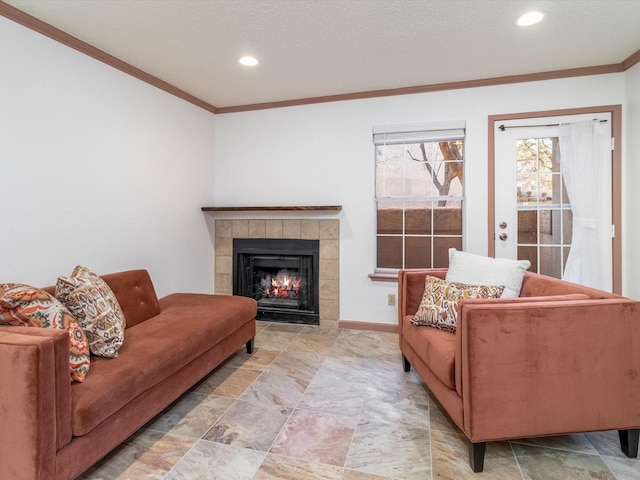 living room featuring ornamental molding and a fireplace