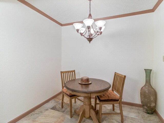 dining area featuring crown molding and a chandelier