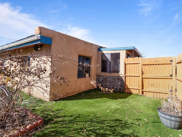 view of property exterior featuring a yard