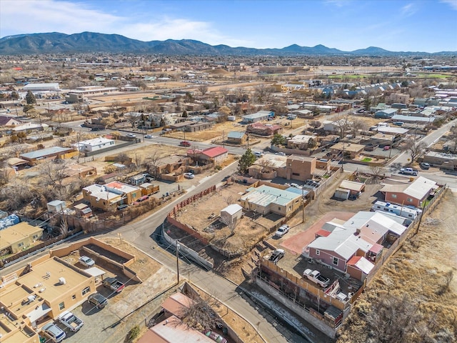 birds eye view of property with a mountain view