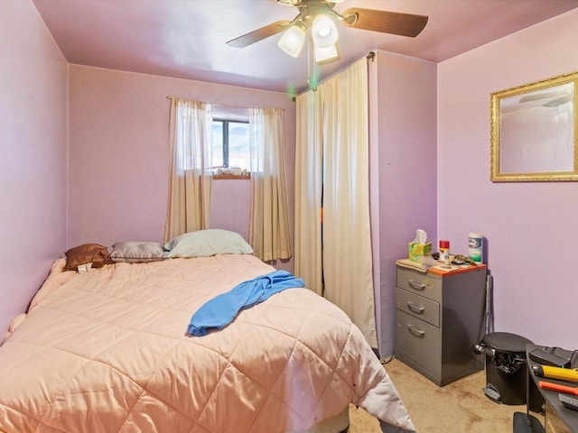 bedroom featuring light colored carpet and ceiling fan