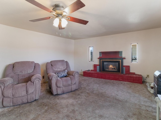 carpeted living room featuring ceiling fan