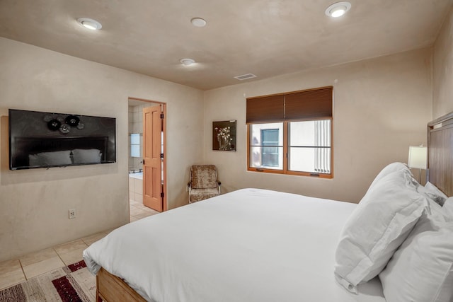 tiled bedroom with ensuite bath