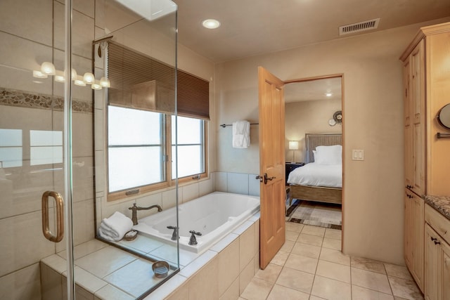 bathroom with tile patterned flooring and plus walk in shower