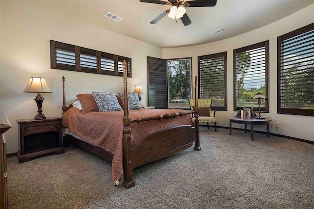 carpeted bedroom featuring ceiling fan, visible vents, and baseboards