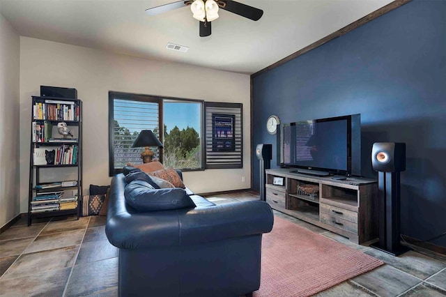 living room featuring visible vents, ceiling fan, and baseboards