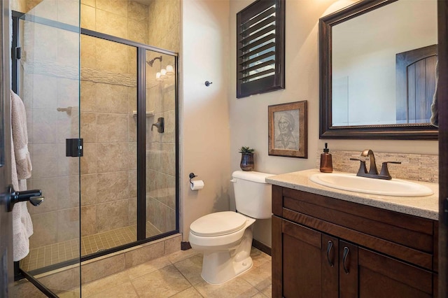 full bath featuring toilet, a shower stall, tile patterned flooring, and vanity