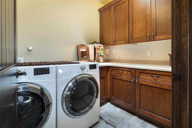 laundry area featuring cabinet space and washer and clothes dryer